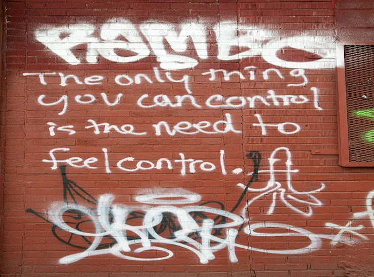 Coercive Control Is About Taking Away Someone Else’s Freedom. Image with graffi on the wall about what control should be