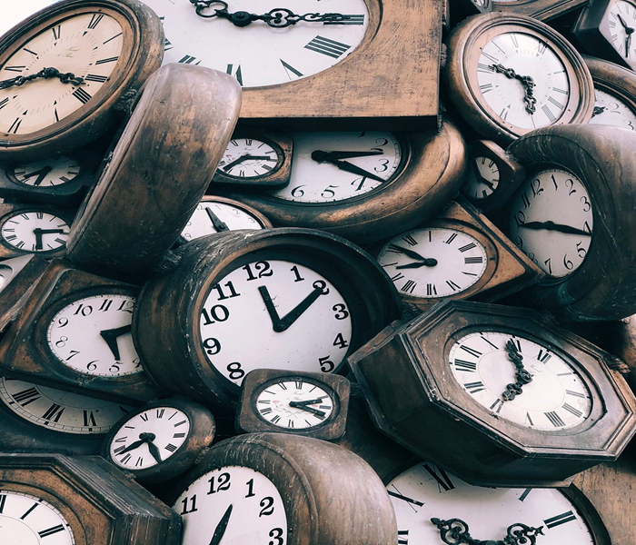 Autistic flow and losing track of time. An image of multiple clocks showing different times, symbolising the loss of awareness of time during autistic flow and deep concentration.